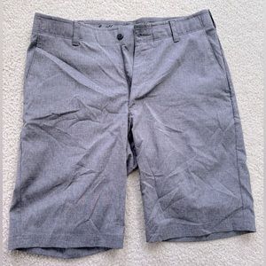 Grey flat front shorts.
